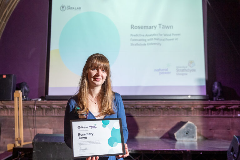 PHD grad Rosemary Tawn holding certification