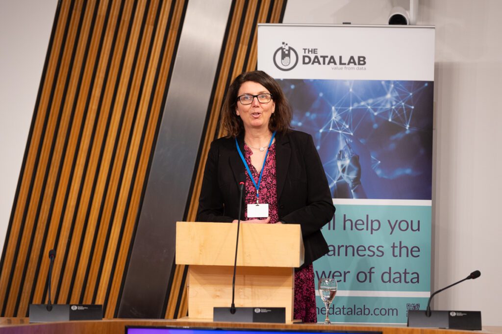 Dr Elizabeth Fairley, Co-founder, Chief Operating and Data Officer of Talking Medicines, addressing the audience at the lectern at our networking event