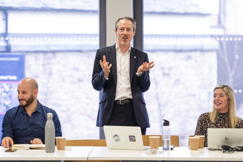 Darran Gardner from The Data Lab gives a talk during the Applying Space Data to the Net Zero Economy conference