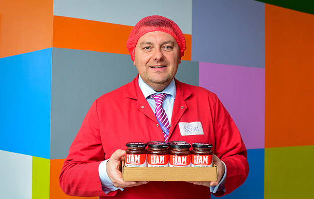 Jam maker holding jam jars