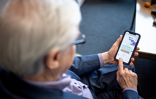 Elderly man using app on mobile phone