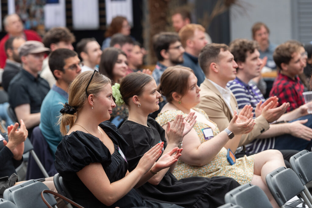 Students at The Data Lab Innovation Week Closing Event 2023 clapping in their seats