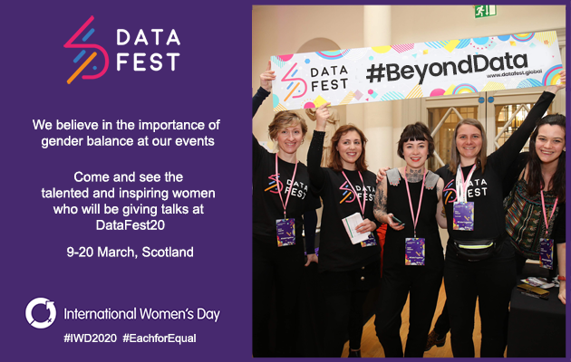 Photo of women holding #BeyondData sign above their heads at DataFest event