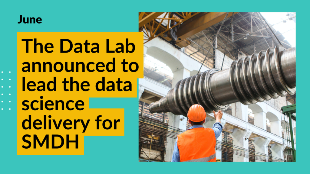 A stock image of a man in an orange construction hat and reflective gear working in a manufacturing settling with large machinery. Overlay text reads "The Data Lab announced to lead the data science delivery for SMDH"