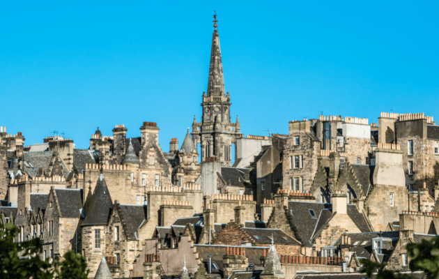 Overview of the Tron Kirk tower and roof tops of houses in Edinburgh