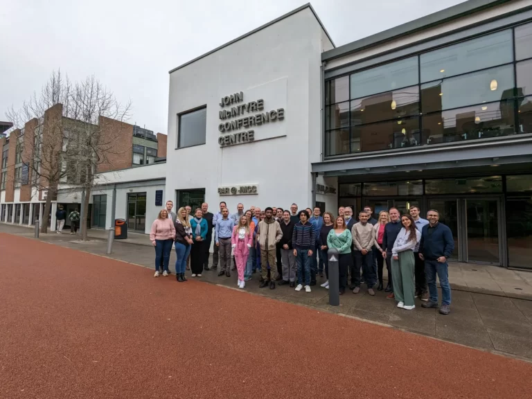 Large group of p[eople from SMDH consortium in front of the John McIntyre Conference Centre